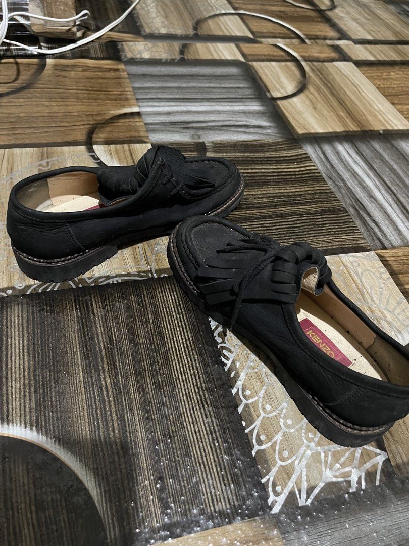 Kenzo Black Suede Tassel Loafers (Category: Casual Shoes) located in Lopez. Submitted by thrift.ni.roms22 (Listing ID 1468947814, Image 3). Description: - Brand: Kenzo - Color: Black with signature pink insoles - Material: Suede upper with chunky rubber lug soles - Design: Slip-on moc toe with fringe and tassel details - Condition: Minor scuffs on the upper from normal wear, soles still have great grip - Style: Chic, chunky, and statement-making.