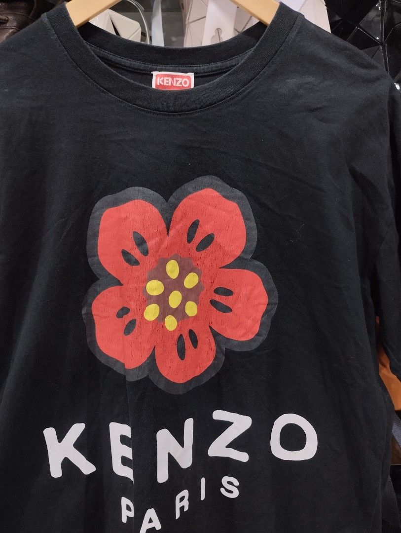 Kenzo Paris Black Flower Tee (Category: Tshirts & Polo Shirts ) located in Manila. Submitted by niggzreyno51476 (Listing ID 1469086548, Image 2). Description: - Brand: Kenzo Paris - Color: Black with red and white chest graphic - Size: S - Material: 100% Cotton - Origin: Made in Portugal - Condition: Authentic with tags and care labels attached - Style: Classic crew neck, short sleeves, casual staple.