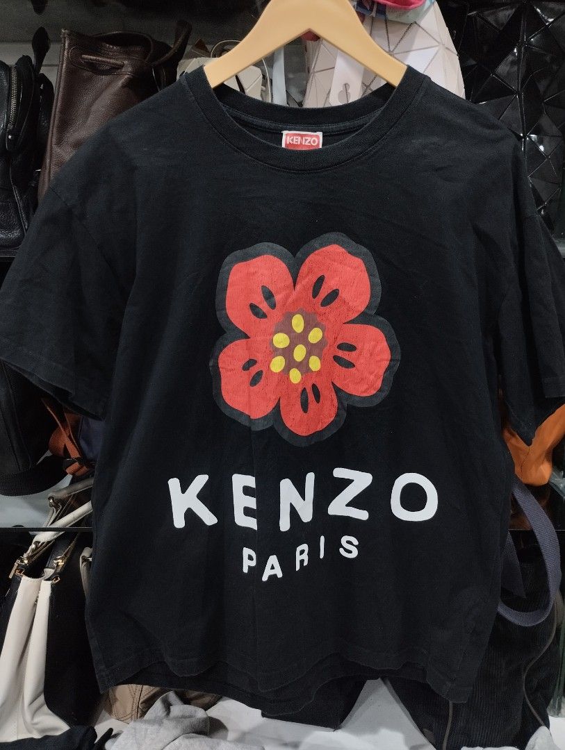 Kenzo Paris Black Flower Tee (Category: Tshirts & Polo Shirts ) located in Manila. Submitted by niggzreyno51476 (Listing ID 1469086548, Image 1). Description: - Brand: Kenzo Paris - Color: Black with red and white chest graphic - Size: S - Material: 100% Cotton - Origin: Made in Portugal - Condition: Authentic with tags and care labels attached - Style: Classic crew neck, short sleeves, casual staple.