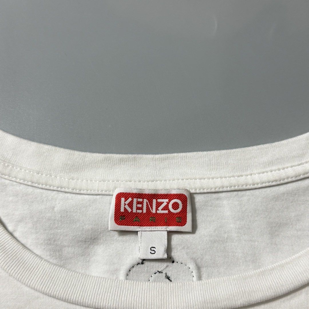Kenzo Paris Elephant Graphic White Tee (Category: Shirts) located in Dagupan City. Submitted by dgp.plvg (Listing ID 1468954833, Image 3). Description: KENZ0 ELEPHANT EMBROIDERED TEE (WOMENS) Size: Small boxy cropped Width: 23-24” Length: 23-24” Condition: good as new Issues: none. Mine: ₱3,000.