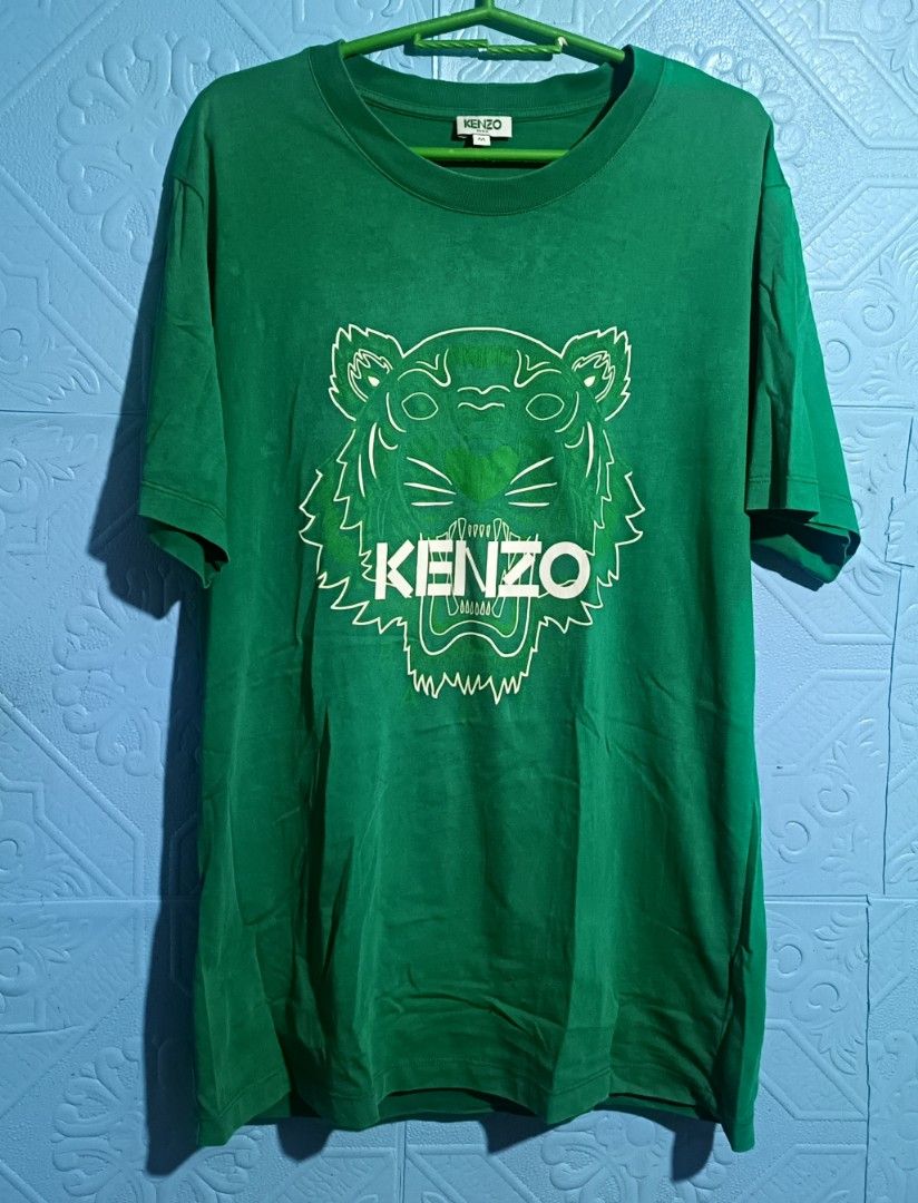 KENZO PARIS TSHIRT (Category: Activewear) located in Quezon City. Submitted by zoesmithshop (Listing ID 1469103937, Image 1). Description: KENZO PARIS GREEN TSHIRT AUTHENTIC SIZE- MEDIUM TO LARGE ISSUE MAY BUTAS SA LIKOD NG BALIKAT.