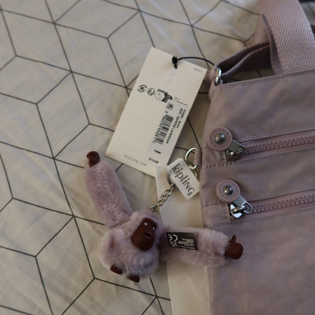 Kipling Serene Lavendar Miah (Category: Shoulder Bags) located in Manila. Submitted by gentlewind_62f064 (Listing ID 1468942521, Image 3). Description: - Brand: Kipling Miah - Colorway: Serene Lavender (Style KI9462 9QR) - Condition: Brand new with tags attached, in original plastic wrapper - Inclusions: Original brand shopping bag and signature furry monkey keychain - Features: Dual top handles and multiple exterior zippered compartments - Retai