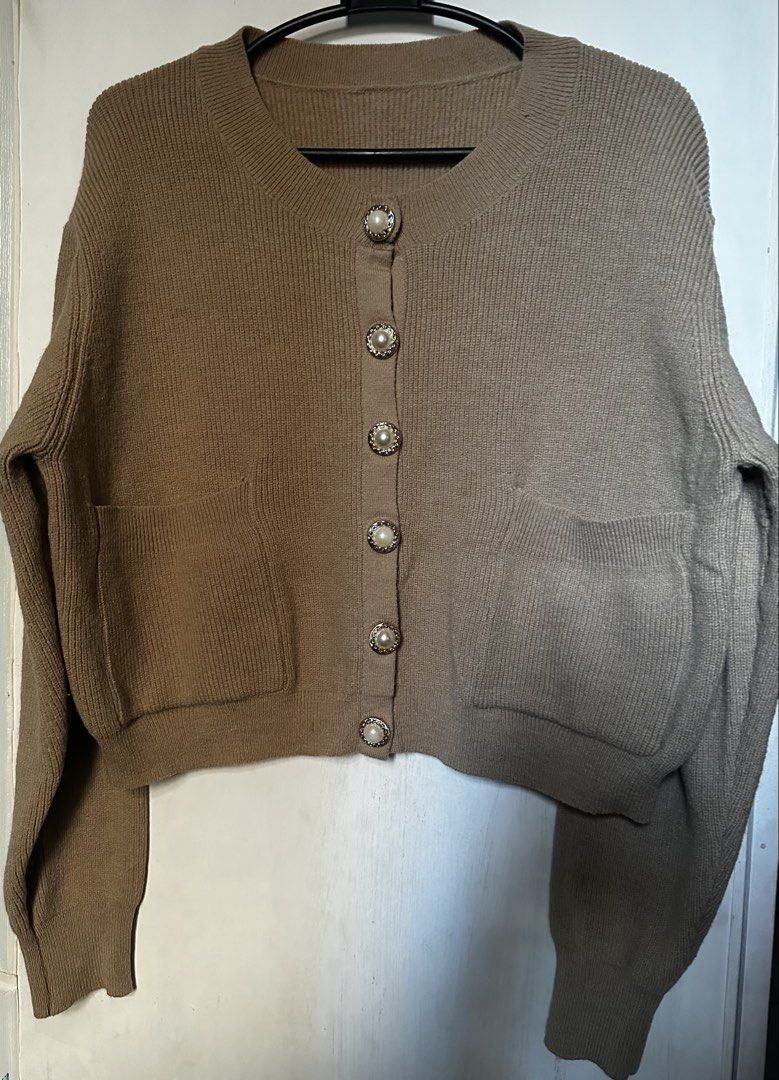 Knitted beige cardigan (Category: Others Tops) located in Cavite. Submitted by chicfinds.slay (Listing ID 1469057178, Image 3). Description: ✨ knitted beige/khaki cardigan ✨best fit s-semi large body frame ✨w/ front pocket/premium quality ✨semi crop .