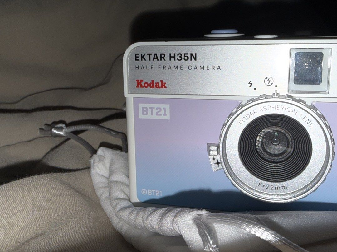 Kodak Ektar H35N BT21 Half Frame Camera Purple (Category: Cameras) located in Manila. Submitted by grandpenguin0925 (Listing ID 1469157498, Image 2). Description: - Kodak Ektar H35N half-frame film camera in limited BT21 special edition - Gorgeous pastel purple and blue gradient colorway with a sleek silver top plate - Shoots standard 35mm film and gets double the shots per roll - Equipped with a built-in flash and 22mm aspherical lens - Includes