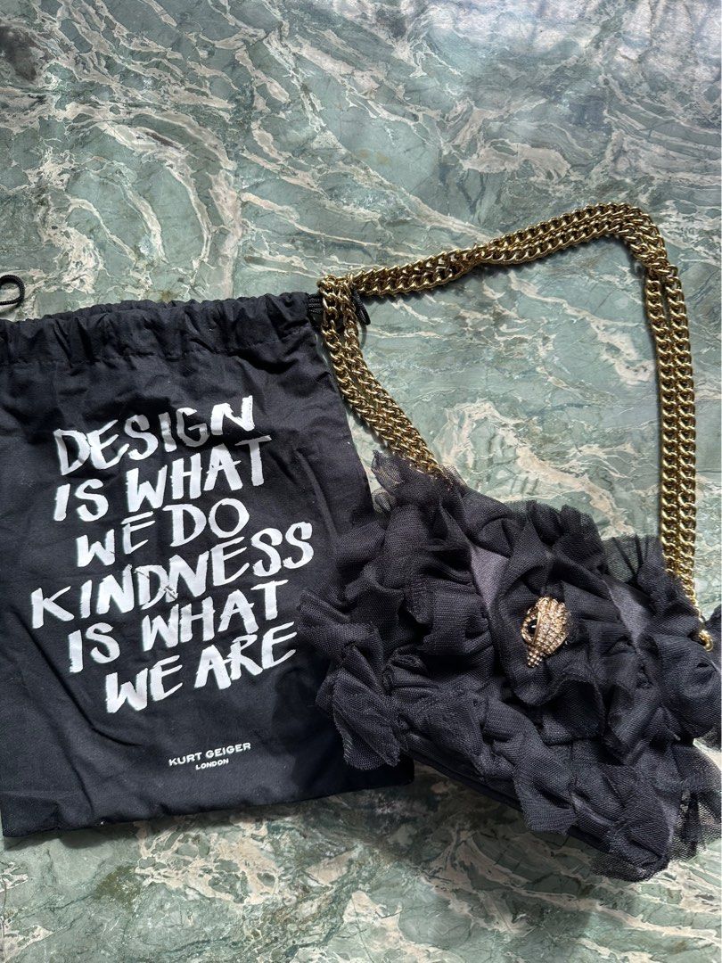 Kurt Geiger London (Category: Shoulder Bags) located in Manila. Submitted by izzzzasclutter (Listing ID 1469099239, Image 1). Description: - Brand: Kurt Geiger London - Style: Kensington Bag - Color: Black with tulle ruffles - Hardware: Gold-tone chain strap - Closure: Crystal-embellished eagle head with magnetic snap flap - Interior: Fabric-lined with slip pocket - Inclusion: Matching black dust bag with graphic print lettering - Condition: Grea