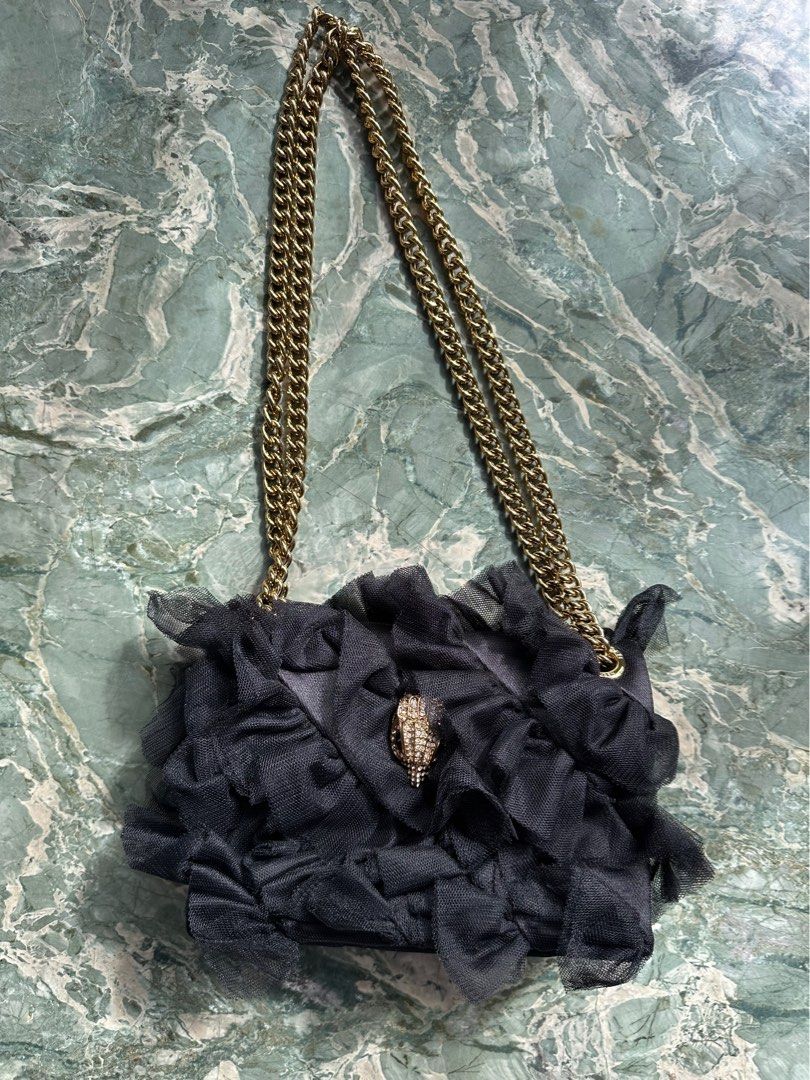 Kurt Geiger London (Category: Shoulder Bags) located in Manila. Submitted by izzzzasclutter (Listing ID 1469099239, Image 2). Description: - Brand: Kurt Geiger London - Style: Kensington Bag - Color: Black with tulle ruffles - Hardware: Gold-tone chain strap - Closure: Crystal-embellished eagle head with magnetic snap flap - Interior: Fabric-lined with slip pocket - Inclusion: Matching black dust bag with graphic print lettering - Condition: Grea