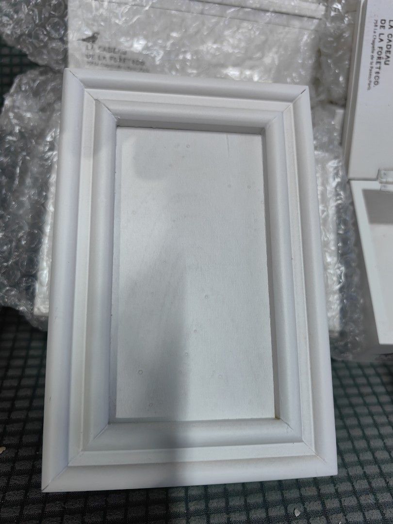 La Cadeau de la Foret Co. White Wooden Box (Category: Accessory Holder, Box & Organizers) located in Rizal. Submitted by gkstcenit (Listing ID 1468936607, Image 3). Description: - Brand: La Cadeau de la Foret Co. - Material: White wood with metal latches and hinged lid - Details: Stamped branding inside the lid - Condition: Brand new, still in bubble wrap with original box tags - Availability: Multiple pieces available - Use: Ideal decorative sto
