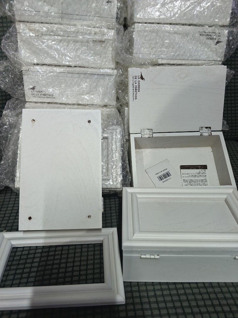 La Cadeau de la Foret Co. White Wooden Box (Category: Accessory Holder, Box & Organizers) located in Rizal. Submitted by gkstcenit (Listing ID 1468936607, Image 2). Description: - Brand: La Cadeau de la Foret Co. - Material: White wood with metal latches and hinged lid - Details: Stamped branding inside the lid - Condition: Brand new, still in bubble wrap with original box tags - Availability: Multiple pieces available - Use: Ideal decorative sto