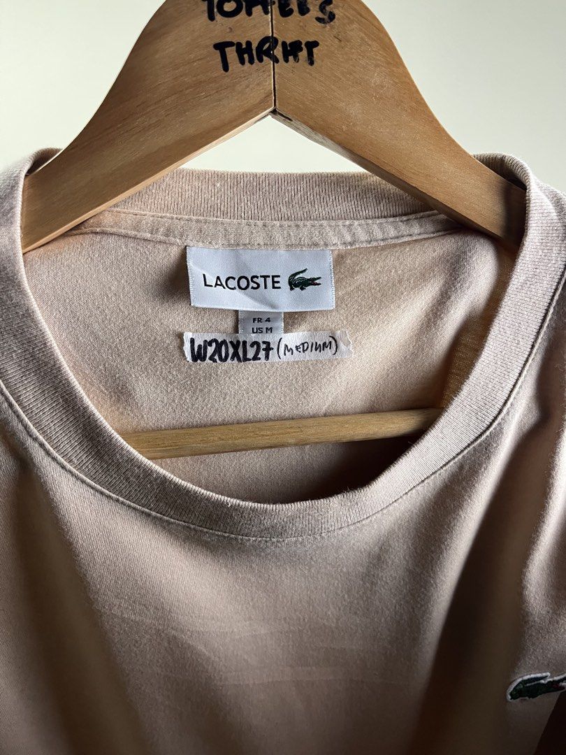 Lacoste Beige T-Shirt Size US Medium (Category: Shirts) located in Malaybalay. Submitted by toffee_s_thrift0.1 (Listing ID 1469052011, Image 2). Description: - Authentic Classic Lacoste T-Shirt - Colorway: Versatile Beige - Size: US Medium / FR 4 - Material: 100% breathable and comfortable cotton - Features: Iconic embroidered crocodile logo on the left chest - Condition: Clean neckline and neat stitching throughout - Style: Simple staple piece, 