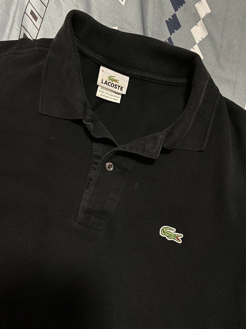 Lacoste Black Polo Shirt Size 5 Devanlay (Category: Tshirts & Polo Shirts ) located in Taguig. Submitted by maaarrrrrcky (Listing ID 1469069499, Image 2). Description: - Brand: Lacoste - Color: Black - Size: 5 (Regular Fit) - Material: Cotton petit piqué - Details: Classic two-button placket with mother-of-pearl buttons, iconic embroidered green crocodile logo - Origin: Designed in France, made in El Salvador by Devanlay - Condition: Clean collar