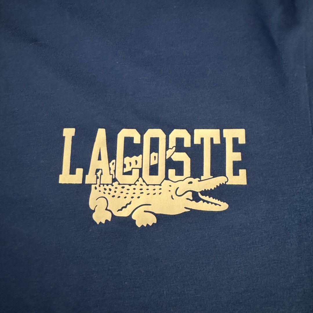 Lacoste Blue C4X Graphic T-Shirt Size 4 Medium (Category: Tshirts & Polo Shirts ) located in Pasig City. Submitted by mon.alcantara (Listing ID 1468931986, Image 2). Description: - Brand: Lacoste Blue C4X - Style: Crew neck tee - Material: 100% Cotton - Size: 4 (Medium) - Condition: Brand new with original store tag attached - Design: Graphic text on the front, and small embroidered logo patch at the back neckline - No paper bag, no box, just the
