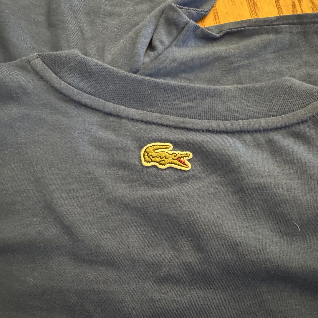 Lacoste Blue C4X Graphic T-Shirt Size 4 Medium (Category: Tshirts & Polo Shirts ) located in Pasig City. Submitted by mon.alcantara (Listing ID 1468931986, Image 3). Description: - Brand: Lacoste Blue C4X - Style: Crew neck tee - Material: 100% Cotton - Size: 4 (Medium) - Condition: Brand new with original store tag attached - Design: Graphic text on the front, and small embroidered logo patch at the back neckline - No paper bag, no box, just the