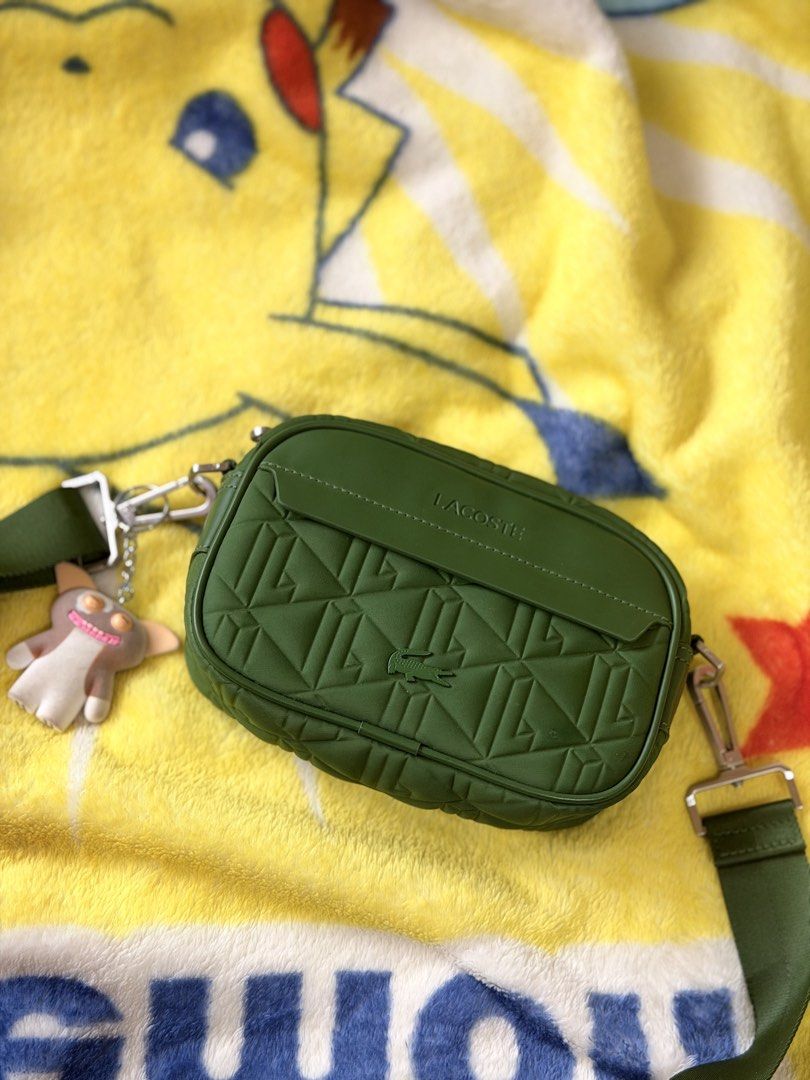 Lacoste Green Crossbody Camera Bag - original (Category: Cross-body Bags) located in Manila. Submitted by hammiedos (Listing ID 1468966013, Image 1). Description: - Quilted green Lacoste crossbody bag - Adjustable strap for comfortable wear - Secure zipper closure - Interior Lacoste logo tag - Ideal for everyday essentials -original -unli check if you want Location sampaloc manila.