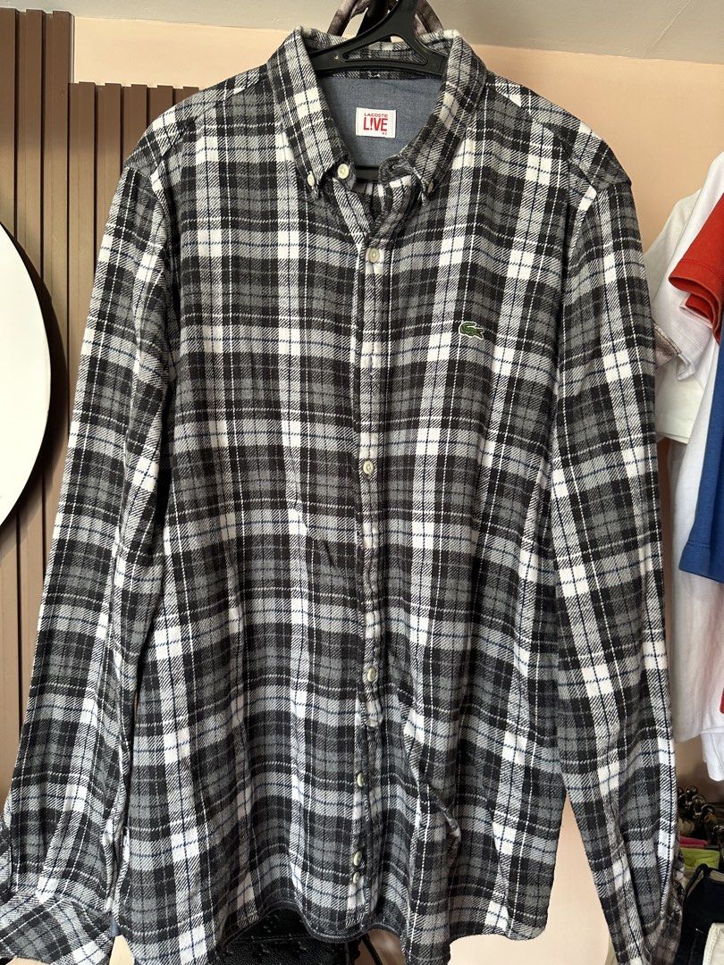 Lacoste Live Plaid Long Sleeve Button Down Shirt (Category: Longsleeves) located in Vinzons. Submitted by melodylarg85741 (Listing ID 1468984343, Image 1). Description: - Brand: Lacoste Live - Style: Button-down plaid flannel shirt - Colorway: Black, grey, and white - Size: 42 - Material: Soft cotton with dark chambray inner collar lining - Details: Classic collar, long sleeves, and iconic embroidered green crocodile logo on the chest - Condition