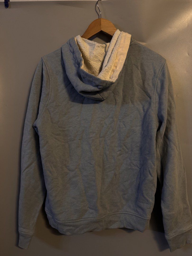 Lacoste Live Zip Hoodie Blue Size 4 (Category: Coats, Jackets and Outerwear) located in Alaminos. Submitted by outfitcheck.ph (Listing ID 1469100174, Image 2). Description: - Brand: Lacoste Live - Color: Dusty blue - Size: 4 (on collar tag) - Material: 80% cotton, 20% polyester blend - Lining: Cozy sherpa fleece for extra warmth - Details: Drawstrings with unique wooden bead ends, front split kangaroo pocket, ribbed cuffs and hem - Condition: Exc