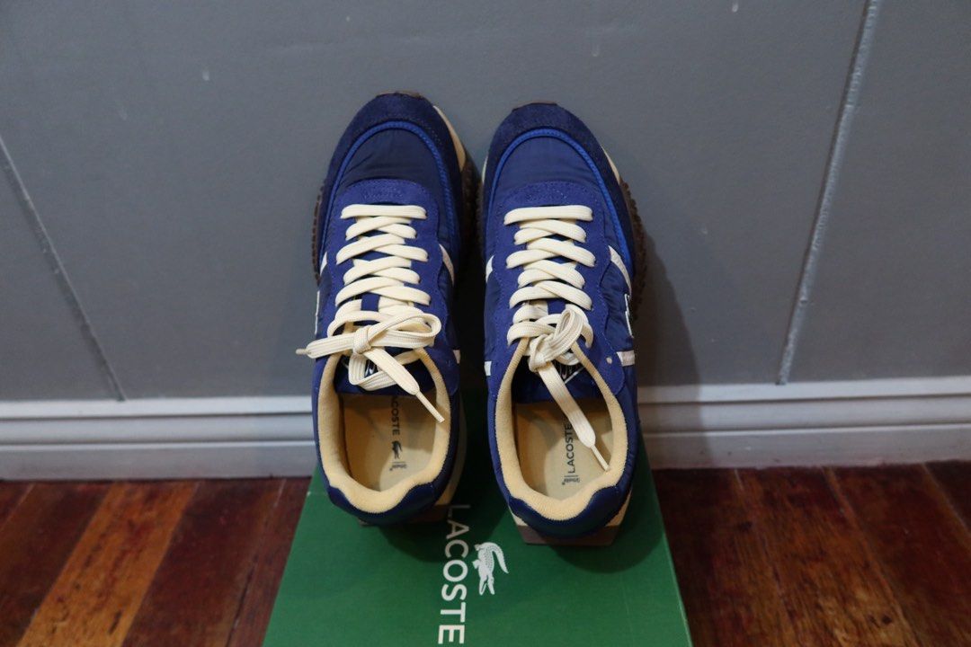 Lacoste L-Spin Deluxe Navy Blue Sneakers (Category: Casual Shoes) located in Pasay City. Submitted by royce.mata.24 (Listing ID 1469094282, Image 3). Description: - Used twice only - Good as new, no signs of use - Model: Lacoste L-Spin Deluxe - Colorway: Navy Blue and Cream - Material: Premium textile and suede upper with chunky textured rubber sole - Details: Signature stitched crocodile logo, cream laces, and matching lining - Inclusions: Compl