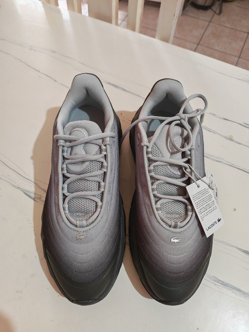 Lacoste Spinor Logo Low Top Sneakers Grey (Category: Sneakers) located in Cebu City. Submitted by rednug (Listing ID 1468952340, Image 3). Description: - Brand: Lacoste - Model: Spinor Sneakers - Colorway: Grey gradient - Condition: Brand new with tags attached, never worn out - Comfort: Ortholite foam insoles for everyday wear - Design: Chunky midsole with signature side crocodile logo.