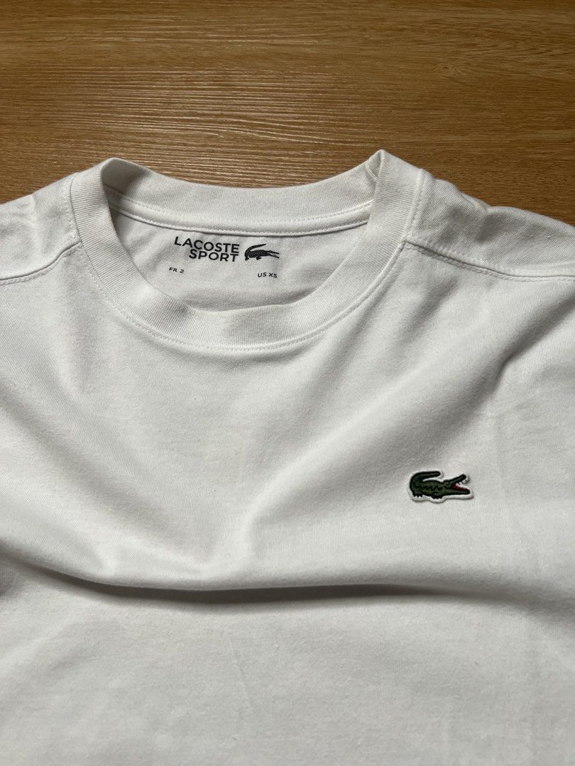 LACOSTE SPORT WHITE TEE (Category: Activewear) located in Cebu City. Submitted by gaston_roux (Listing ID 1468944812, Image 2). Description: 20.5x27 Good condition Needs wash.