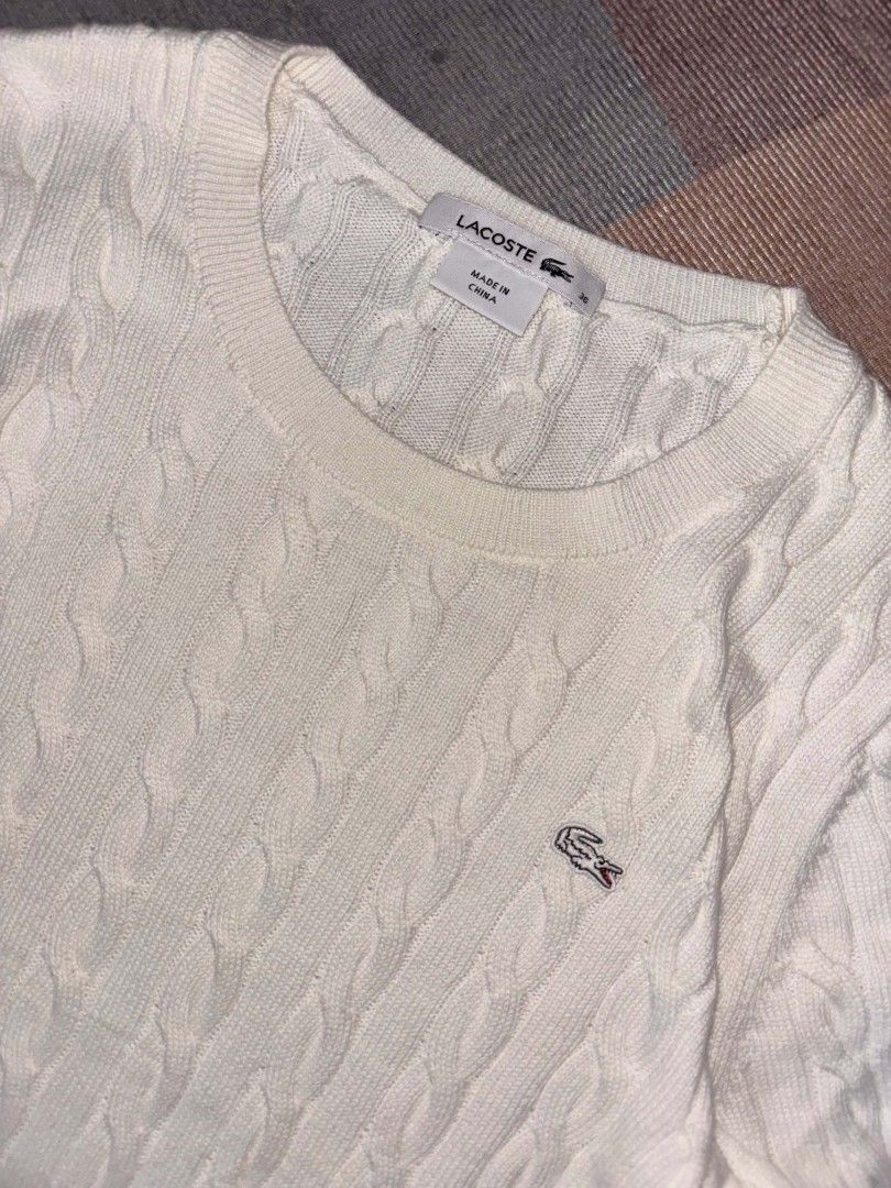 Lacoste White Cable Knit Sweater (Category: Longsleeves) located in Manila. Submitted by adriane.s_lootz (Listing ID 1468978254, Image 3). Description: Lacoste Cable knit Pristine condition No flaws Measurements Width 17 length 23 📍Nova Qc.