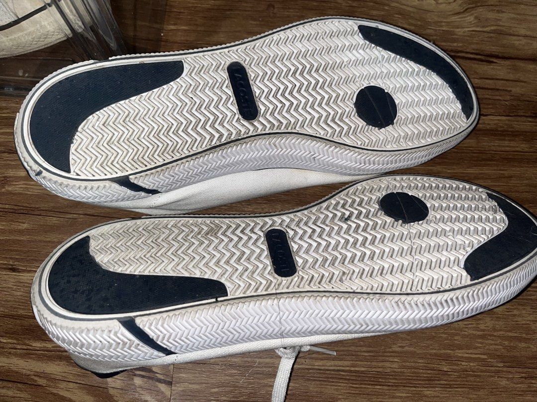 Lacoste White Canvas Sneakers (Category: Sneakers) located in San Pablo. Submitted by crazyr17 (Listing ID 1468971000, Image 3). Description: - Brand: Lacoste - Color: White canvas with dark navy heel tabs and green crocodile embroidery - Closure: Traditional lace-up with white laces - Comfort: OrthoLite insoles for all-day wear - Soles: Textured rubber with black and dark navy contrast inserts - Condition: Normal signs of wear on fabric and sole