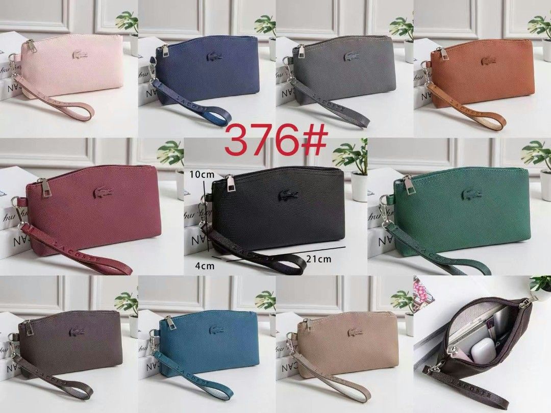 Lacoste Wristlet Pouch Multiple Colors Available 21cm x 10cm (Category: Purses & Pouches) located in Manila. Submitted by jonalyn19 (Listing ID 1468946906, Image 1). Description: - Brand: Lacoste - Style: Textured wristlet pouch with iconic front crocodile logo - Dimensions: 21cm (L) x 10cm (H) x 4cm (W) - Closure & Strap: Top zipper closure with matching wrist strap featuring embossed lettering - Interior: Lined, spacious enough for a phone, key