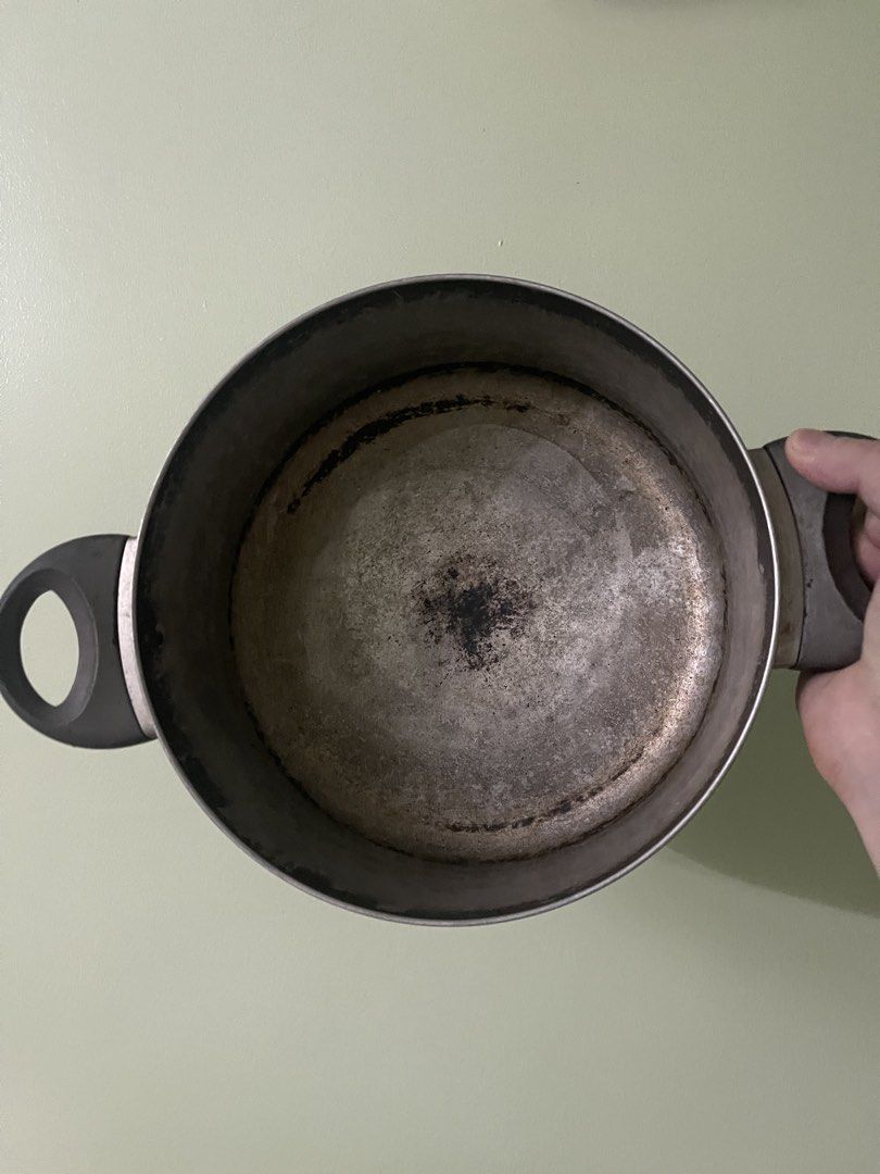 Large Cooking Pot with Lid and Handles (Category: Cookware & Accessories) located in Manila. Submitted by pasaybestfinds (Listing ID 1469070059, Image 2). Description: - Big metal cooking pot with matching lid - Sturdy side handles securely attached - Heavy exterior chipping and wear exposing metal - Interior shows staining and burnt marks from use - Still 100% functional for heavy-duty boiling and soup making - Budget-friendly find for practical