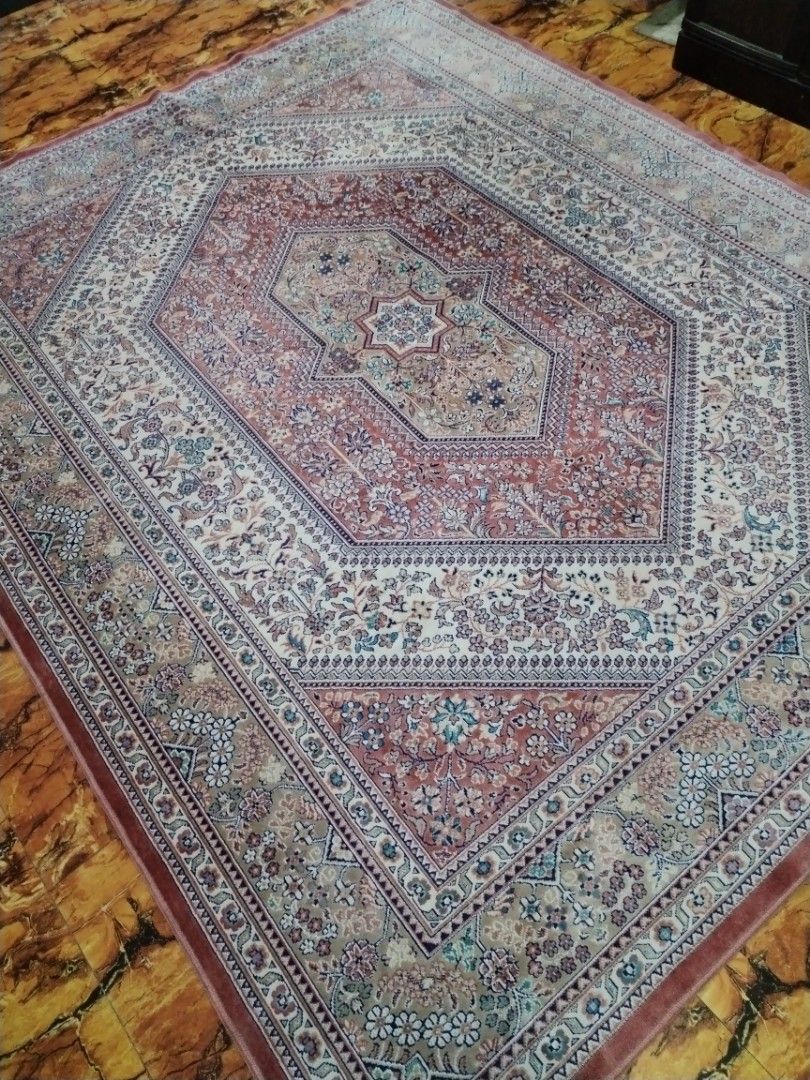 Large Persian Style Floral Pattern Area Rug (Category: Carpets, Mats & Flooring) located in Caloocan City. Submitted by rowely_jpn (Listing ID 1469101242, Image 2). Description: Large area rug with detailed floral patterns throughout. Features a central medallion design in shades of red, beige, and blue. Traditional border framing the edges. Soft texture, great for living rooms or bedrooms. Clean condition, neatly rolled and stored..