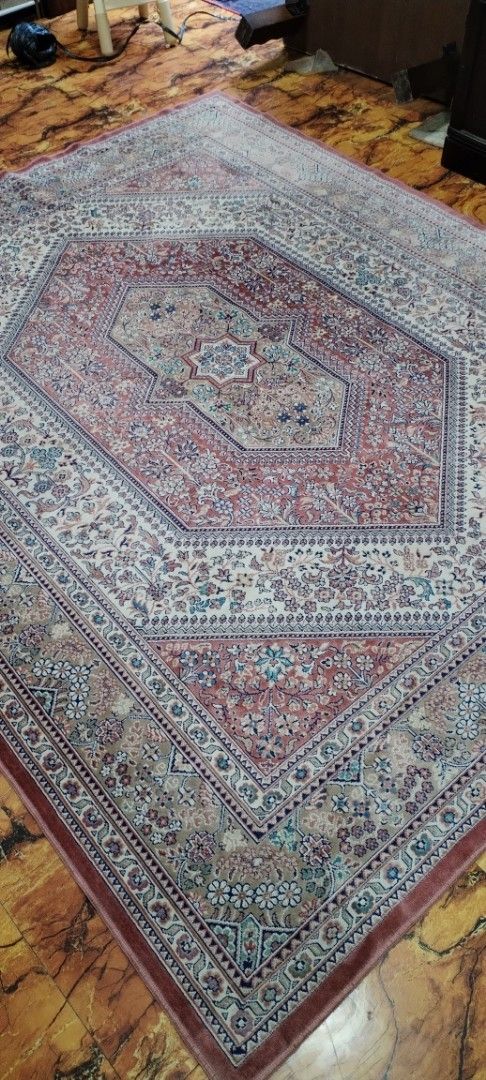 Large Persian Style Floral Pattern Area Rug (Category: Carpets, Mats & Flooring) located in Caloocan City. Submitted by rowely_jpn (Listing ID 1469101242, Image 1). Description: Large area rug with detailed floral patterns throughout. Features a central medallion design in shades of red, beige, and blue. Traditional border framing the edges. Soft texture, great for living rooms or bedrooms. Clean condition, neatly rolled and stored..
