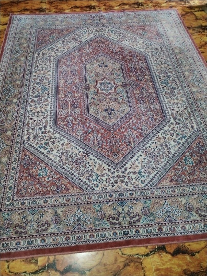 Large Persian Style Floral Pattern Area Rug (Category: Carpets, Mats & Flooring) located in Caloocan City. Submitted by rowely_jpn (Listing ID 1469101242, Image 3). Description: Large area rug with detailed floral patterns throughout. Features a central medallion design in shades of red, beige, and blue. Traditional border framing the edges. Soft texture, great for living rooms or bedrooms. Clean condition, neatly rolled and stored..