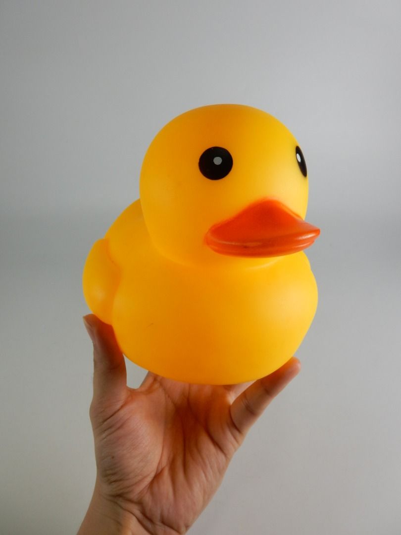 Large Yellow Rubber Duck Bath Toy (Category: Kids Toys) located in Bacoor. Submitted by banananana12 (Listing ID 1469011513, Image 2). Description: - Item: Classic yellow rubber duck bath toy - Color: Bright yellow with an orange bill and black eyes - Condition: Excellent, clean surface with no scuffs or marks - Features: Standard size for tub or pool play with a small central hole at the bottom.