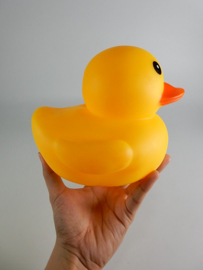 Large Yellow Rubber Duck Bath Toy (Category: Kids Toys) located in Bacoor. Submitted by banananana12 (Listing ID 1469011513, Image 3). Description: - Item: Classic yellow rubber duck bath toy - Color: Bright yellow with an orange bill and black eyes - Condition: Excellent, clean surface with no scuffs or marks - Features: Standard size for tub or pool play with a small central hole at the bottom.