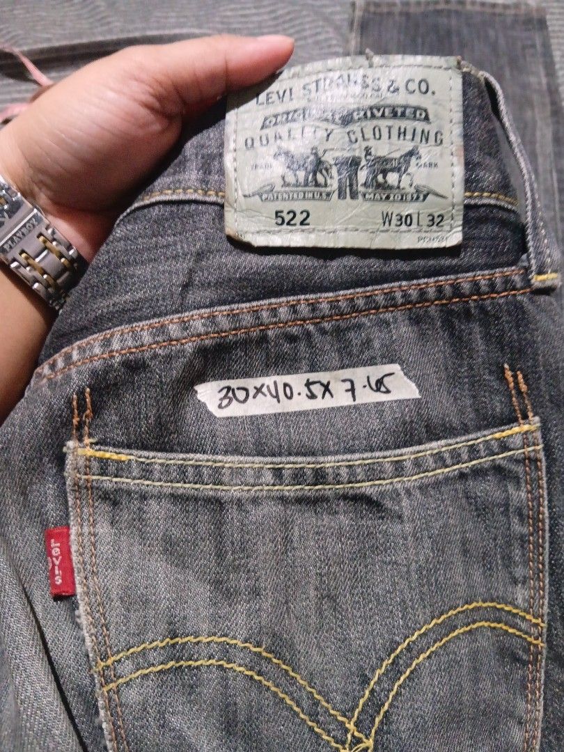 Lebays 522 Denim Jeans Not Stretch (Category: Jeans) located in Valenzuela. Submitted by AnahThrift (Listing ID 1469043888, Image 1). Description: - Brand: Lebays - Model: 522 Slim Taper - Size: W30 L32 - Color: Dark grey wash - Material/Origin: Made in China - Features: Classic five-pocket styling, button fly, contrast yellow stitching, signature red tab, and leather waistband patch.