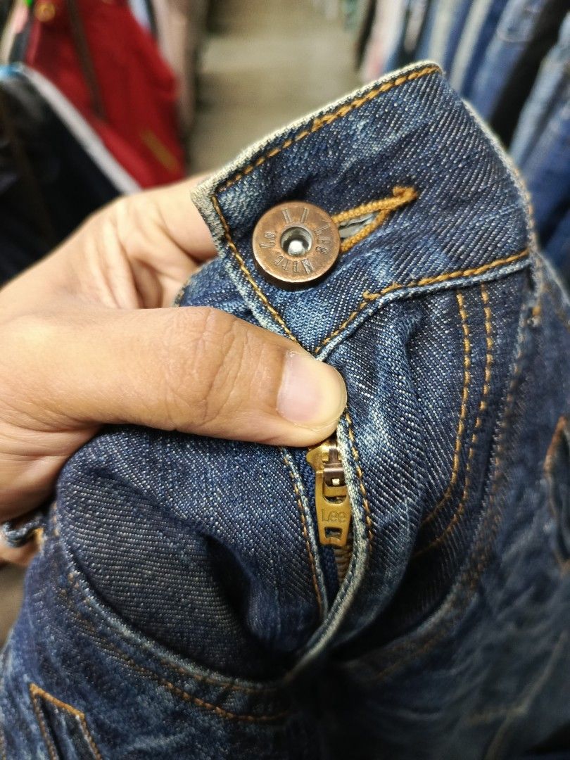 Lee H.D. Lee Merc. Co. Denim Jeans (Category: Jeans) located in Cabatuan. Submitted by penthegreat (Listing ID 1469110665, Image 3). Description: - Brand/Model: Lee H.D. Lee Merc. Co. Hardware 1889 denim jeans - Wash: Dark blue wash with contrast stitching - Fit: Straight leg cut with paneled detailing - Pockets: Multi-pocket design featuring angled utility front pockets and patched rear pockets - Hardware: Button fly with custom branded hardware