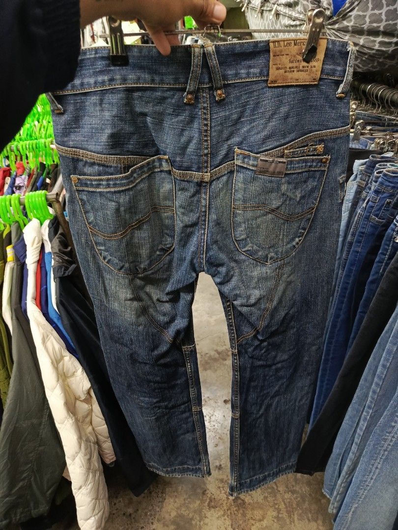 Lee H.D. Lee Merc. Co. Denim Jeans (Category: Jeans) located in Cabatuan. Submitted by penthegreat (Listing ID 1469110665, Image 2). Description: - Brand/Model: Lee H.D. Lee Merc. Co. Hardware 1889 denim jeans - Wash: Dark blue wash with contrast stitching - Fit: Straight leg cut with paneled detailing - Pockets: Multi-pocket design featuring angled utility front pockets and patched rear pockets - Hardware: Button fly with custom branded hardware