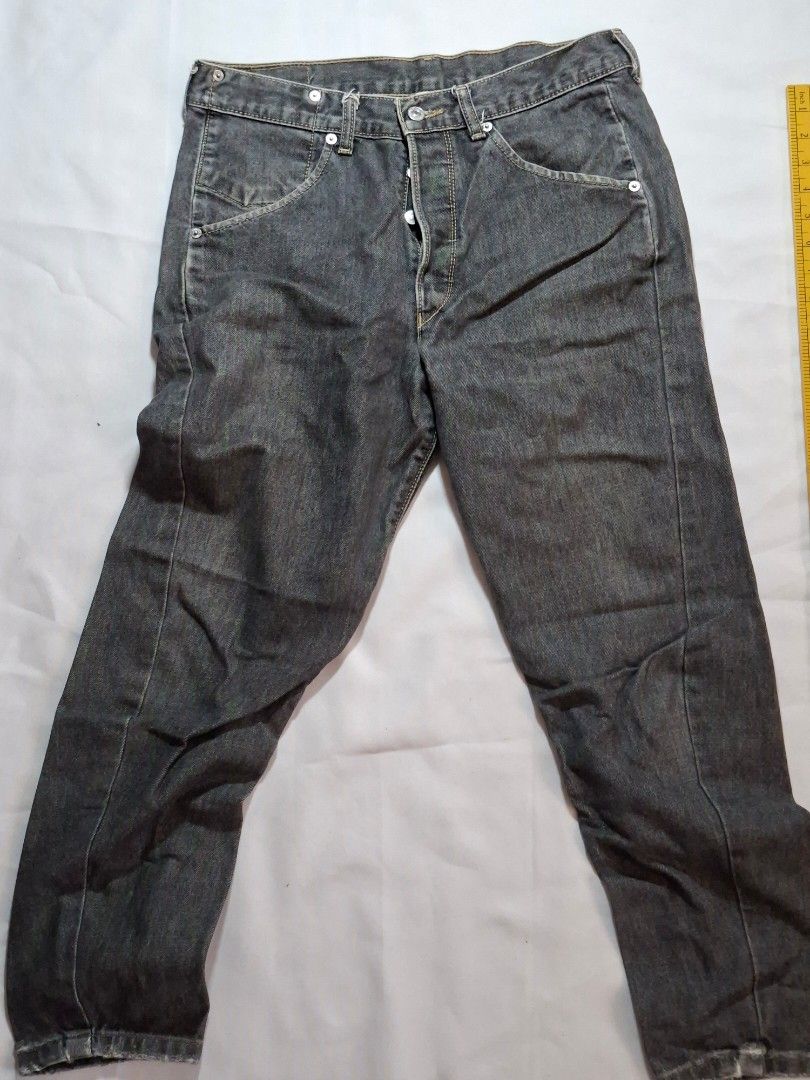 Levi Strauss & Co. Black Denim Jeans (Category: Jeans) located in Baguio. Submitted by restyrille77846 (Listing ID 1468998709, Image 1). Description: - Brand: Levi Strauss & Co. - Color: Classic Black - Closure: Button fly with branded metal buttons - Fit: Straight leg cut with traditional five-pocket styling - Condition: Good pre-loved condition with natural fraying and wear along the bottom hems.