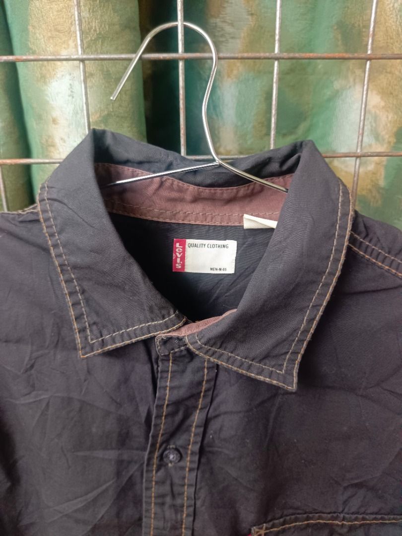 Levi's Black Button-Up (Category: Coats, Jackets and Outerwear) located in Caloocan City. Submitted by jie_theseller17 (Listing ID 1469078711, Image 2). Description: - 2-piece men's casual bundle ready to ship - Piece 1: Levi's black long-sleeve button-up shirt with front chest pockets, contrasting brown inner collar trim, and white contrast stitching - Piece 2: Timberland white short-sleeve crewneck t-shirt with a black woven logo patch on the c