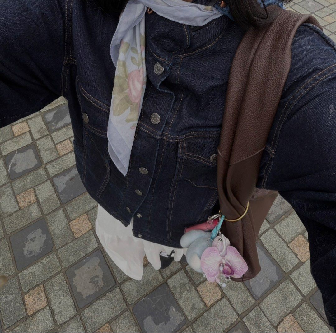 Levi's Denim Jacket Dark Wash (Category: Coats, Jackets and Outerwear) located in Quezon City. Submitted by clareb (Listing ID 1468963405, Image 1). Description: - Used once - Brand: Levi's - Wash: Dark wash denim - Features: Button-up front, metallic hardware, dual chest pockets - Unique Detail: Zipper accent along the back edge of the collar - Stitching: Contrast orange stitching throughout - Fit/Style: Great layering staple piece - Origin: Mad