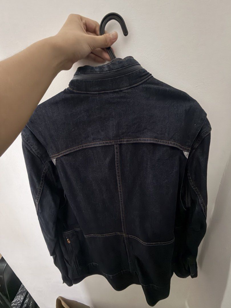 Levi's Denim Jacket Dark Wash (Category: Coats, Jackets and Outerwear) located in Quezon City. Submitted by clareb (Listing ID 1468963405, Image 3). Description: - Used once - Brand: Levi's - Wash: Dark wash denim - Features: Button-up front, metallic hardware, dual chest pockets - Unique Detail: Zipper accent along the back edge of the collar - Stitching: Contrast orange stitching throughout - Fit/Style: Great layering staple piece - Origin: Mad