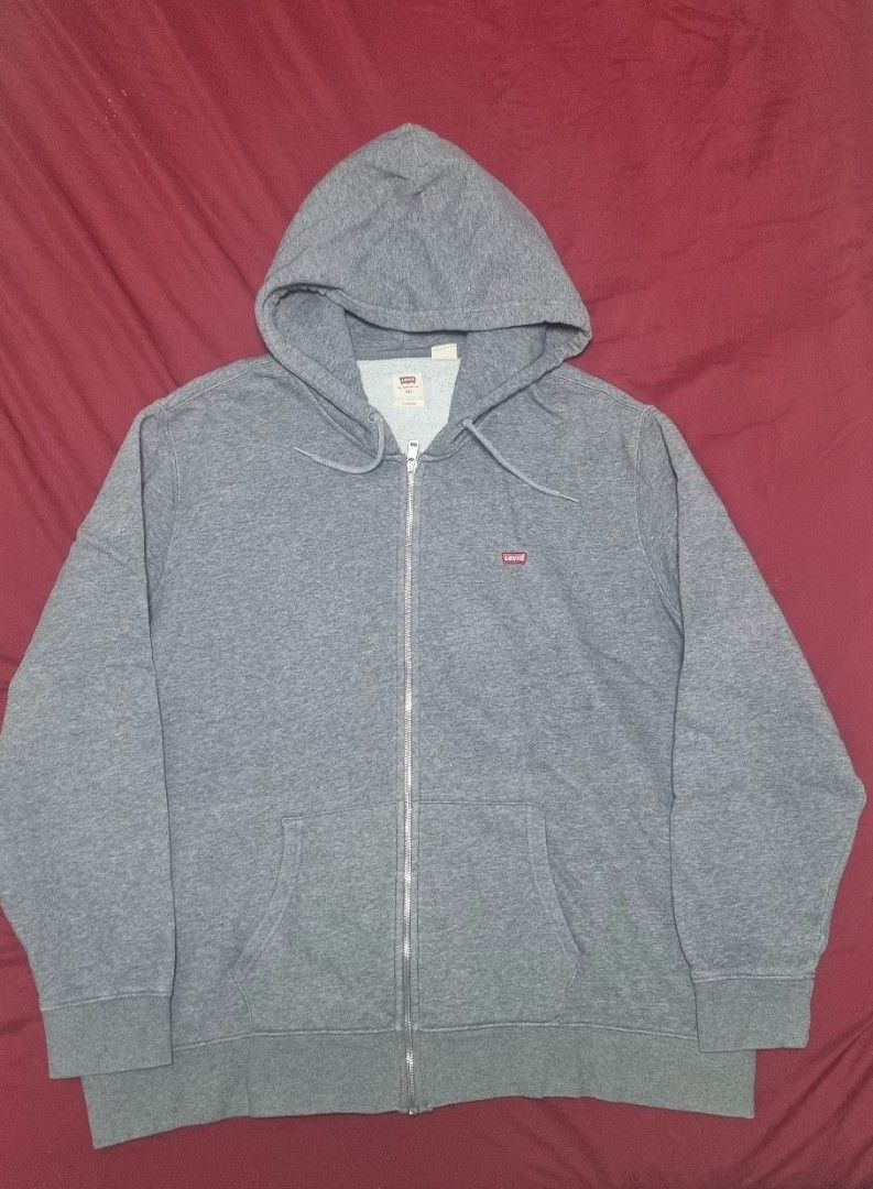 Levi's Grey Zip-Up Hoodie (Category: Hoodies) located in Manila. Submitted by ags028705 (Listing ID 1469158637, Image 1). Description: - Brand: Levi's - Style: Zip-up hoodie / sweatshirt - Size: XXL - Color: Grey - Features: Front zipper, split kangaroo pockets, adjustable drawstrings at hood, small red Levi's tab logo on chest - Interior: Soft, cozy fleece - Condition: Excellent everyday casual wear - Mode of Payment: GCash, BPI, or Bank Transfe