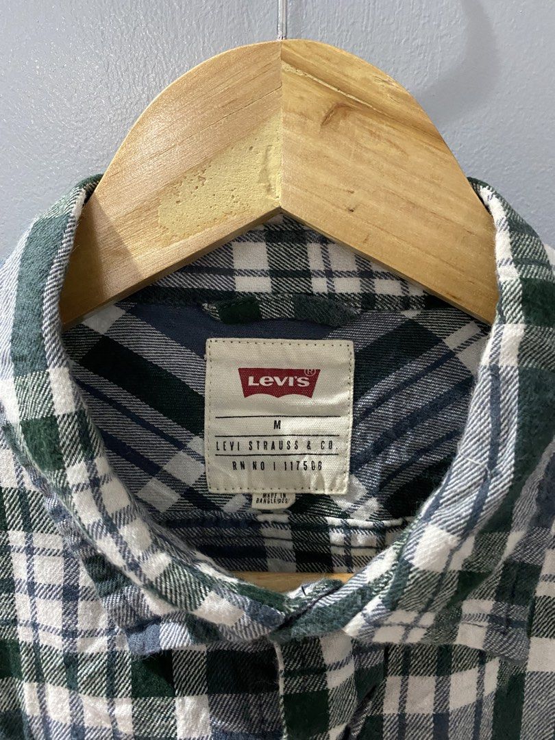 Levi's Plaid Long Sleeve Button-Down Shirt (Category: Longsleeves) located in Bangued. Submitted by koroysthrifts (Listing ID 1469074341, Image 3). Description: - Brand: Levi's 20x26 - Colorway: Green, navy blue, and white plaid - Material: 100% cotton (soft and comfortable for daily wear) - Features: Button-down front, classic collar, dual chest pockets, and buttoned cuffs - Fit: Standard men's sizing - Condition: Excellent quality, ready to wea