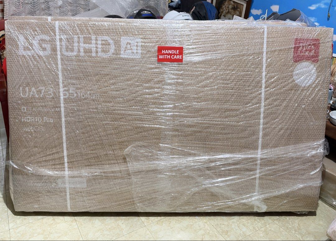 LG UHD 65 inch 4K Smart TV (Category: TV) located in Pasay City. Submitted by zette_ (Listing ID 1469043133, Image 1). Description: - Condition: Brand new, factory-sealed, completely unopened and wrapped in store plastic - Display: Massive 65-inch (164cm) 4K resolution screen - Performance: Powered by the a7 Gen8 AI processor - Features: Includes HDR10 Pro and webOS - Perfect for: Upgrading your living room home entertainment setup.