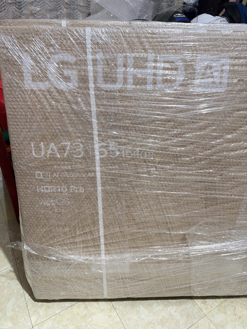 LG UHD 65 inch 4K Smart TV (Category: TV) located in Pasay City. Submitted by zette_ (Listing ID 1469043133, Image 2). Description: - Condition: Brand new, factory-sealed, completely unopened and wrapped in store plastic - Display: Massive 65-inch (164cm) 4K resolution screen - Performance: Powered by the a7 Gen8 AI processor - Features: Includes HDR10 Pro and webOS - Perfect for: Upgrading your living room home entertainment setup.