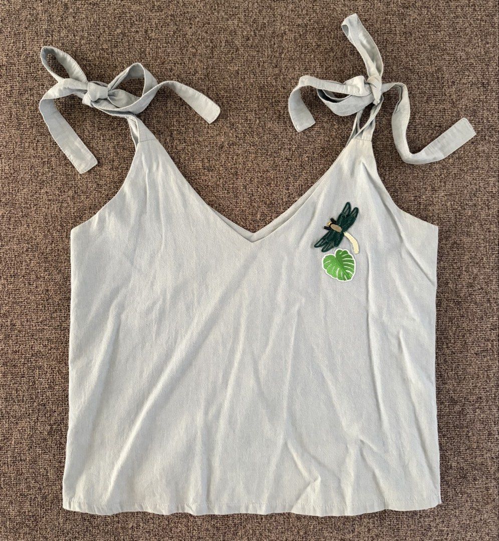 Light Blue Dragonfly Tie-Shoulder Tank Top (Category: Sleeveless) located in Quezon City. Submitted by snoopiii (Listing ID 1468999793, Image 1). Description: RFS: Decluttering Loc: QC.