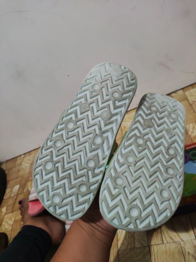 Light Blue Heart Pattern Slide Sandals Slippers (Category: Slippers and slides) located in Paranaque City. Submitted by jtaguirre (Listing ID 1468934390, Image 2). Description: - Color: Light blue with colorful heart charms - Style: Casual slip-on sandals - Features: Textured footbed for grip and zig-zag patterned rubber sole - Condition: Clean overall, minor dirt on soles from handling - Usage: Perfect for indoors or outdoors.