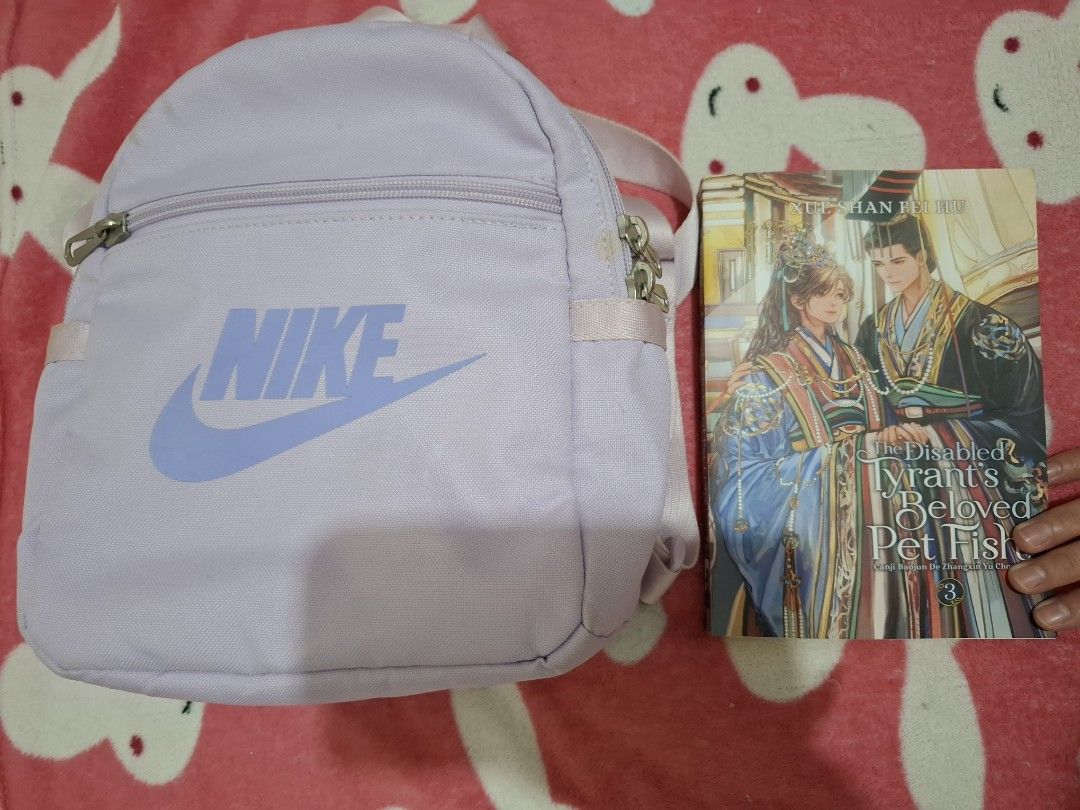 Light Purple Nike Mini Backpack (Category: Backpacks) located in Cardona. Submitted by zaynes_icejasminetea (Listing ID 1468935258, Image 2). Description: - Authentic Nike pastel purple mini bag - Size comparison on listing pic - May mantsa sya na maliit nasa pic po - No damages or whatever - Used but not abvsed .