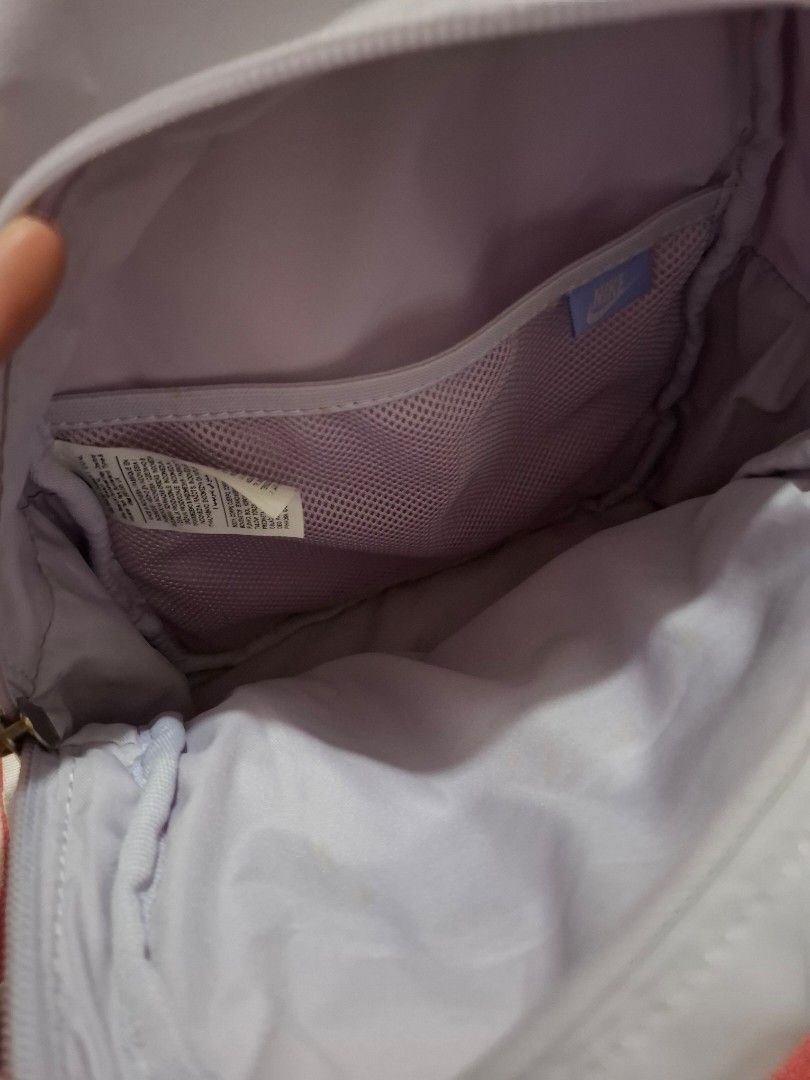 Light Purple Nike Mini Backpack (Category: Backpacks) located in Cardona. Submitted by zaynes_icejasminetea (Listing ID 1468935258, Image 3). Description: - Authentic Nike pastel purple mini bag - Size comparison on listing pic - May mantsa sya na maliit nasa pic po - No damages or whatever - Used but not abvsed .
