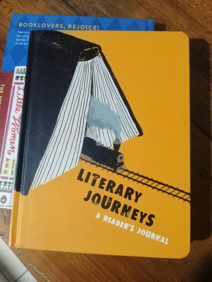 Literary Journeys: A Reader's Journal Book (Category: Storybooks) located in Baguio. Submitted by klutter.curio (Listing ID 1468953545, Image 2). Description: - Product: Literary Journeys Reader's Journal with André Letria illustrations - Exterior: Bright yellow hardcover featuring a charming vintage train and book design - Condition: Brand new and completely unused - Interior Features: Dedicated pages for book titles, authors, plot and character
