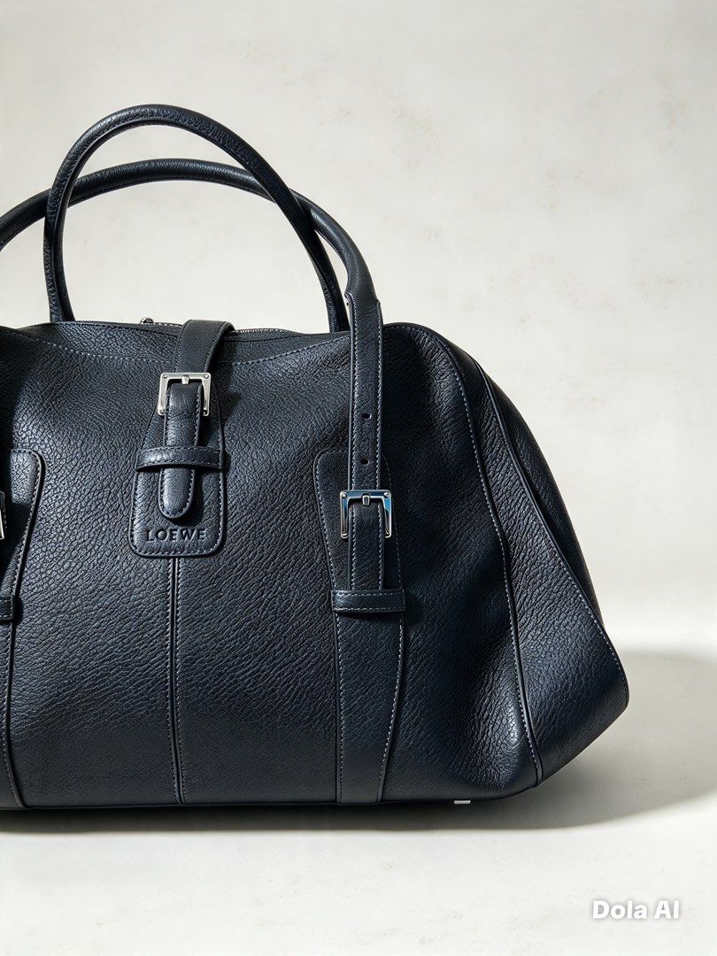 Loewe Black Leather Handbag (Category: Luxury Bags & Wallets) located in Aroroy. Submitted by mahinaanlangs (Listing ID 1469029170, Image 3). Description: Loewe Black Leather Handbag Legit Large Size Very Good Condition Issue:Kunti Gasgas At Maliit na punit sa loob Pero Bagong Bago pa sya sa labas 12k+Sf .