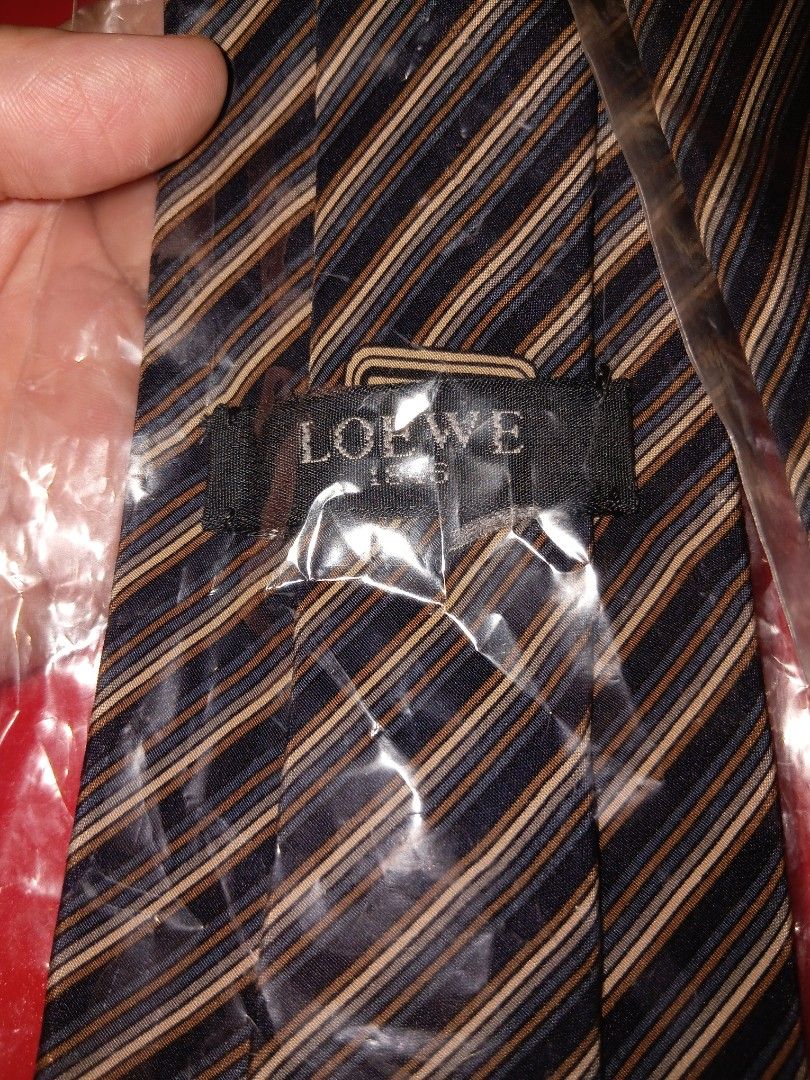 LOEWE stripe necktie (Category: Ties) located in Quezon City. Submitted by threetwotwo2ndaccount (Listing ID 1468931763, Image 2). Description: Loewe stripe necktie good as new need dry clean stock bawal sa maselan bawal sa barat.