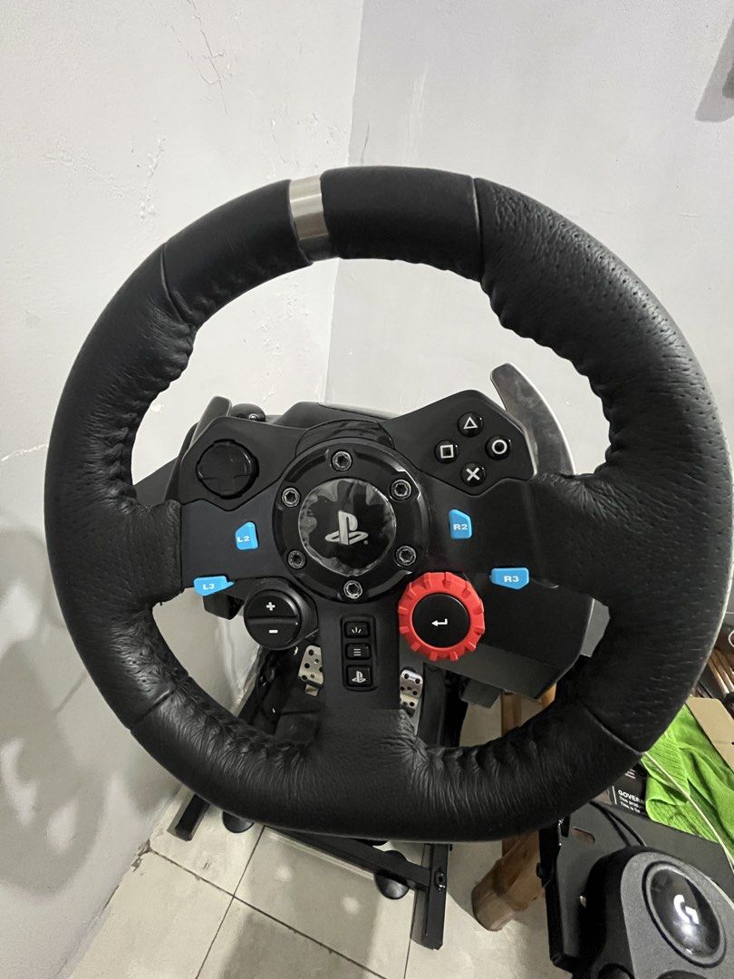 Logitech G29 Racing Wheel Driving Force Shifter and Stand (Category: Controllers) located in Manila. Submitted by cedsoriano89686 (Listing ID 1468963403, Image 3). Description: - Complete Logitech G29 racing setup including pedals, Driving Force shifter, and a heavy-duty metal stand - Leather-wrapped wheel maintains a great, tactile texture - Pedals and shifter are 100% fully functional - Original boxes included for both the wheel and shifter - I